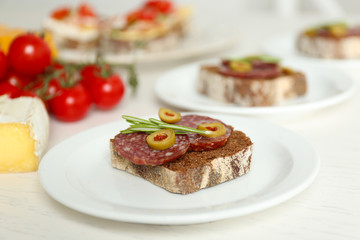 Tasty sandwiches on plates, close up