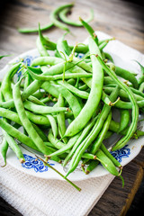 raw green beans on a gray wooden table,.healthy food