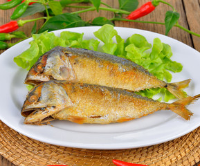 Fried Mackerel on wooden background