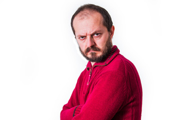 Portrait of angry man in red sweater, with beard and mustaches