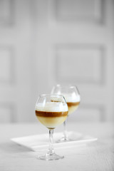 Wine glass with jelly on light background