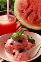 Watermelon ice cream in bowl  on color wooden background