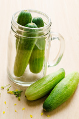 Fresh cucumber on wooden background