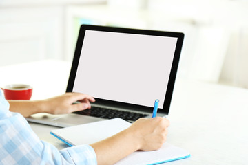 Woman working with laptop in office