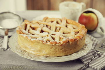 Homemade apple pie on wooden background