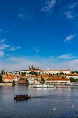 Naklejka na ściany i meble View of colorful old town and Prague castle with river Vltava, C