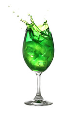 Green water spread in a wine glass isolated on white.