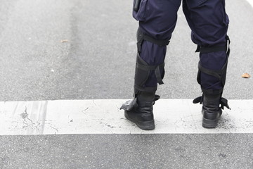 Police Officer in Tactical Boots with Protectors