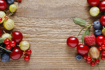 Delicious fruits on wooden background