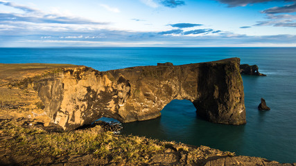 Fototapeta na wymiar Magnificent rock arch at Dyrholaey, Iceland