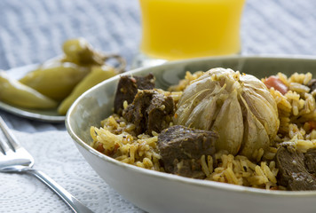 Traditional pilaf with garlic and spices 