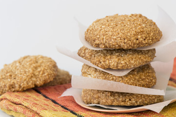 Homemade sesame cookies on white background