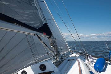 Yacht sailing with full sails