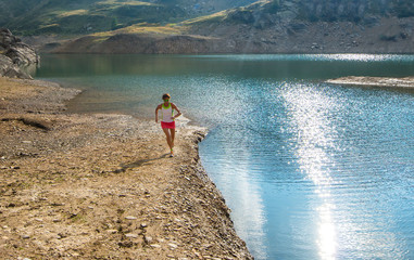 Running near mountain lake