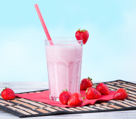 Fresh milk shake on wooden table 
