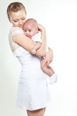 Happy mother with her newborn son 