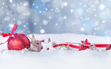 Christmas background with red baubles,snow and snowflakes, free space for text. Christmas decoration. 