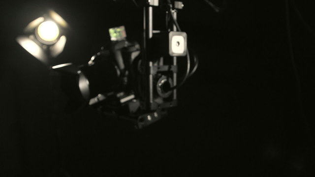 Camera jib crane with remote hot head operation in studio