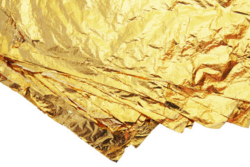 pile of gold leafs isolated on a white background