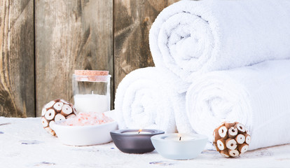 Spa still life with aromatic candles and towels