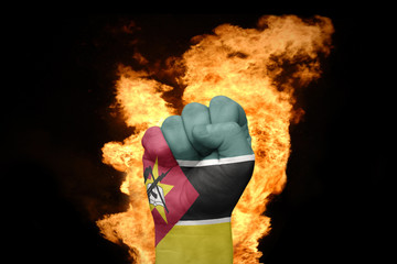 fire fist with the national flag of mozambique