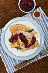 Blintzes or Pancakes with Blueberries. Selective focus.