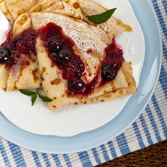 Blintzes or Pancakes with Blueberries. Selective focus.