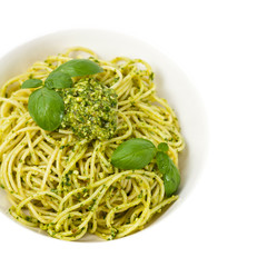 Spaghetti with pesto and basil. Selective focus.