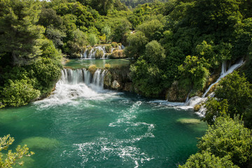 Fototapeta na wymiar Scenic view of waterfalls, cascades and lush foliage at the Krka National Park in Croatia.