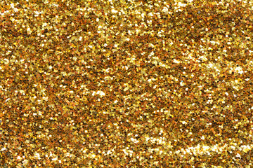 Holiday yellow glitter, gold sand and dust texture. Golden sparkles