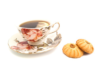 mug of tea with lemon and cookies
