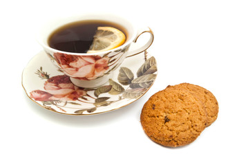 oatmeal cookies and mug of tea with lemon