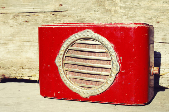 Ancient red wooden radio. Retro of radio