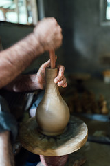 The ceramist make jug from clay