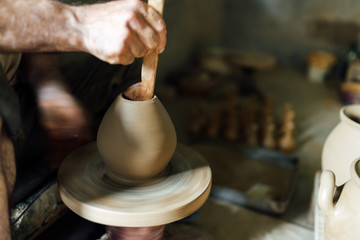 The potter  make vase from clay