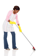 young african housewife sweeping
