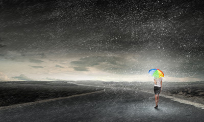 Businesswoman with umbrella