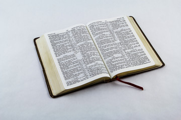 Open Bible on White Background