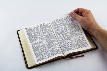 Obraz premium Reading a Bible on White Background