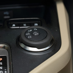 close up of multiple function control by button in modern car
