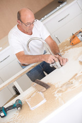 Carpenter fitting a sink