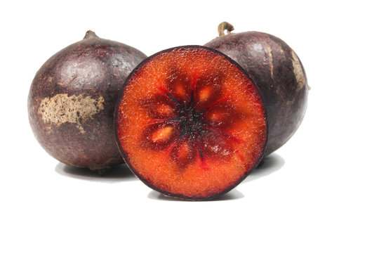 Flacourtia fruit over white background
