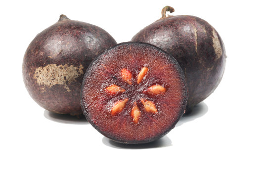 Flacourtia fruit over white background
