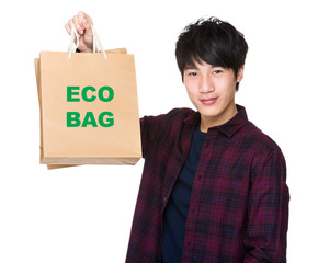 Asian Man hold with shopping bag and showing phrase of eco bag
