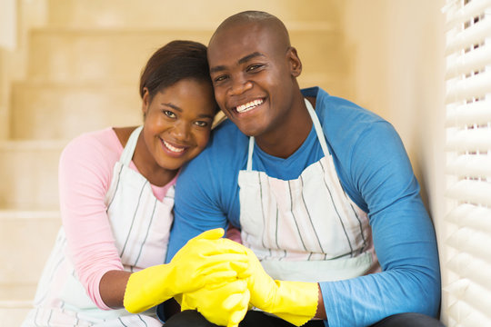 young african couple relaxing after housework