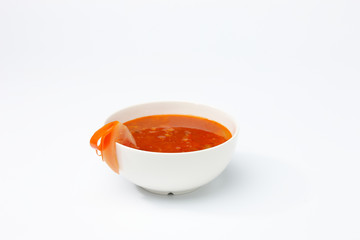 Vegetarian soup in white cup.