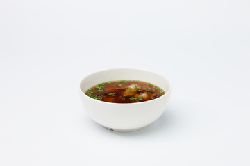 Vegetarian soup in white cup.