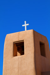 Traditional New Mexico church tower with blue sky in Santa Fe, New Mexico