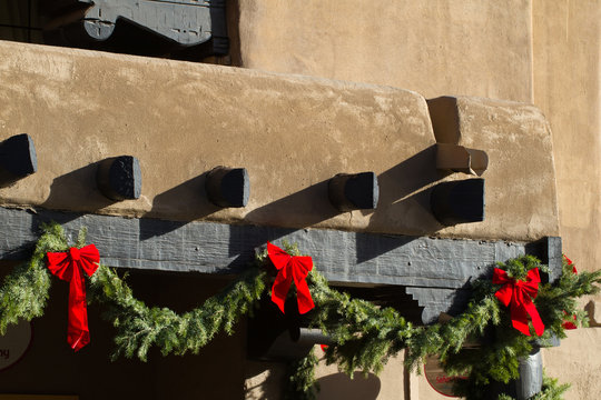 Green boughs and red bows make Santa Fe, New Mexico, festive at Christmastime