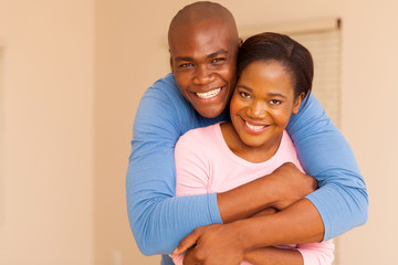 Fototapeta premium african american man hugging his wife